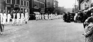 Ku Klux Klan members march down Larimer Street in Denver, 1926.