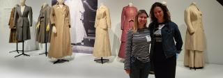 Jori Johnson and Kimberly Kronwall stand in front of mannequins wearing historic fashion.