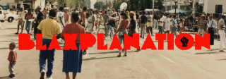 Historic color photo of people on a  street with the logo for Blaxplanation superimposed over the photo