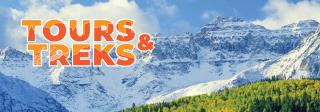 Tours & Treks in large orange block font overlaid over the snow-peaked rocky mountains.