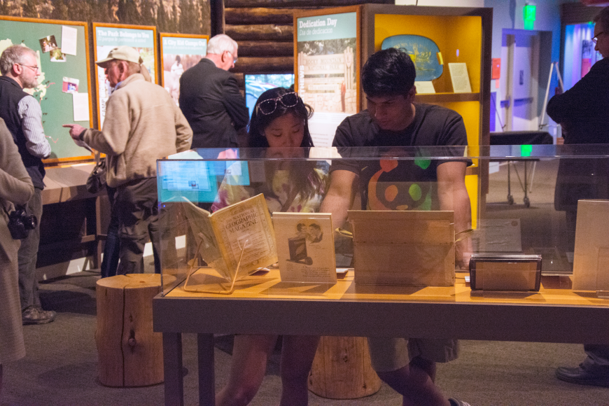 A pair of visitors examine a RMNP100 displace case.