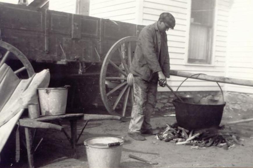 Frank Carnes making soap, 1916.