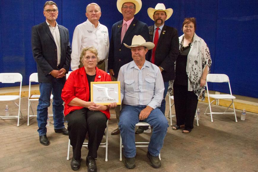 Sanders-Naugle-5NLLC Farm members with their certificate.
