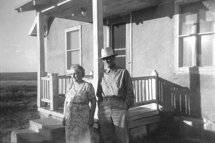 Sam and Dola Cole standing outside the house, 1957.