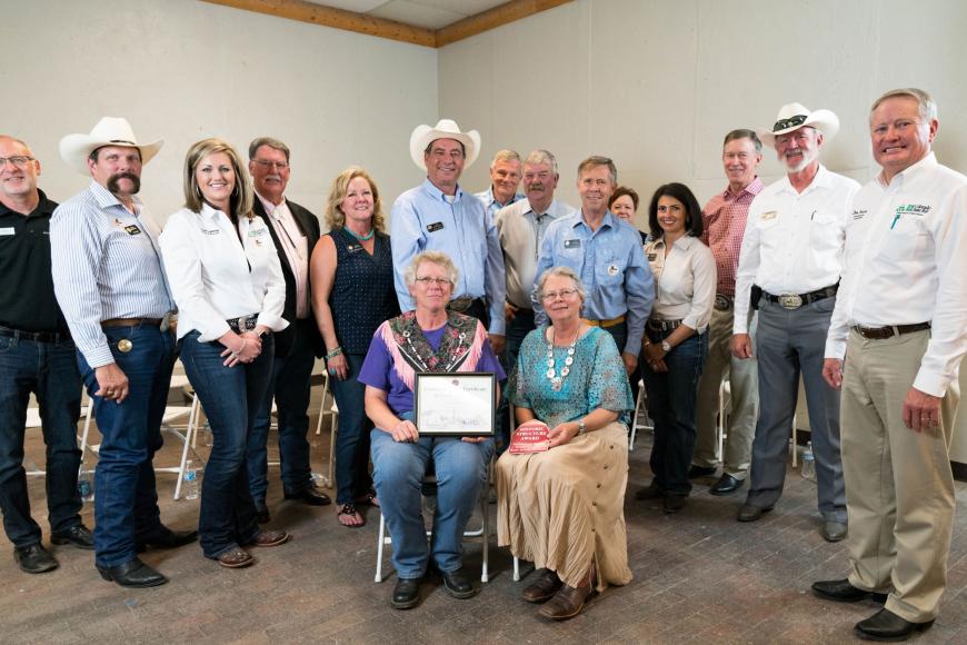 Golen family of the Hohnholz Ranch (seated) with their Centennial Ranch certificate.