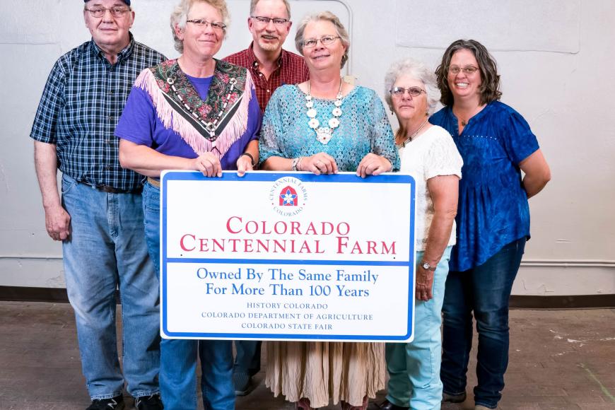 The Golen family with their Centennial Farm sign.