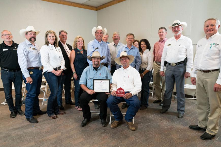 KOK Ranch members (seated) with their Centennial Ranch certificate.