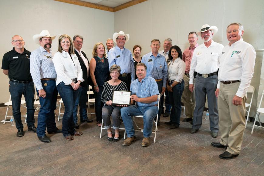 Members of the Coe family (seated) with their Centennial Farms certificate.