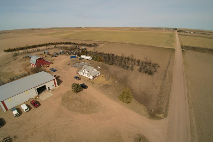 Present day aerial view of Seger Farms showing the house and outbuildings just off the county road.