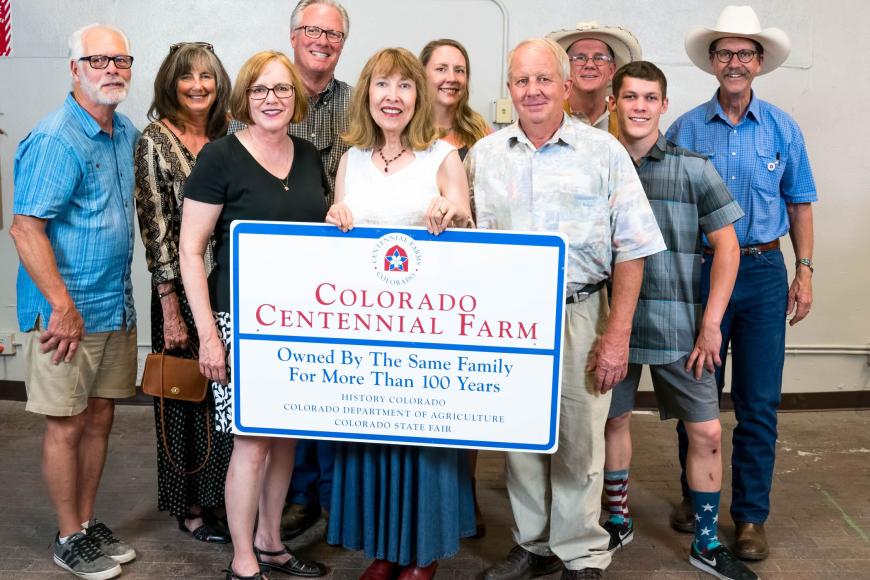 Members of the Sunnyside Farms families with their Centennial Farms sign.