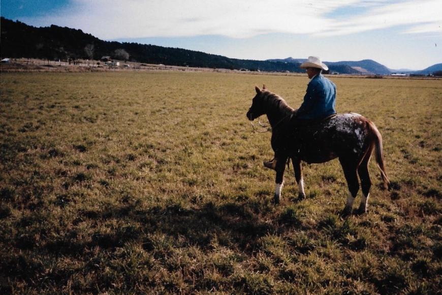 A man on horseback on Sunnyside Farms.