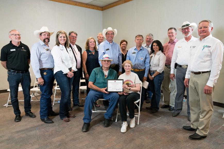 Members of the Ugolini Farm Dairy (seated) with their certificate.