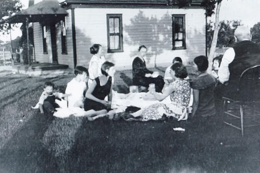 A family picnic at the Ugolini Farm Dairy in the 1940s.  The original house is in the background.
