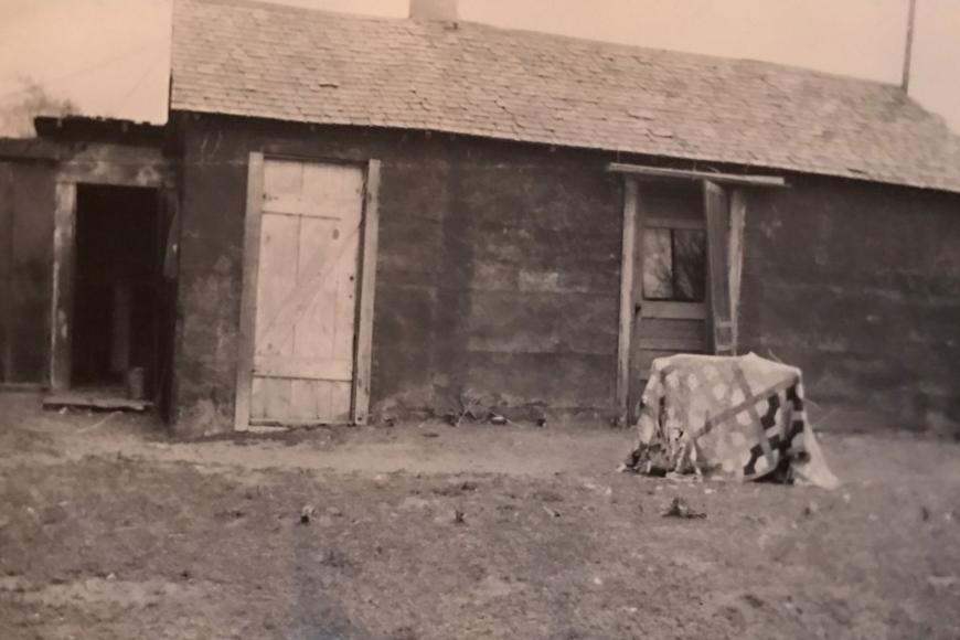 Historic photo of an old building on the ranch.