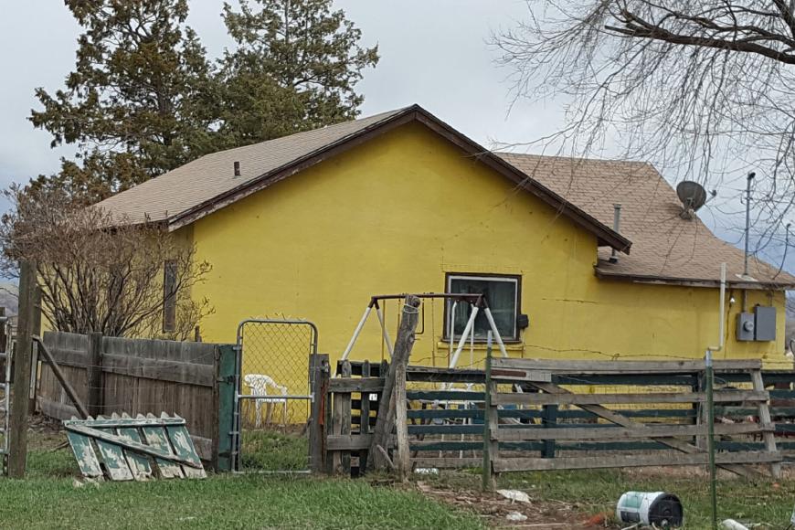 Yellow-painted 1914 stucco house in 2016.