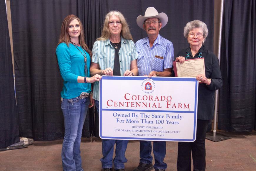 The Smith family with their Centennial Farm sign.