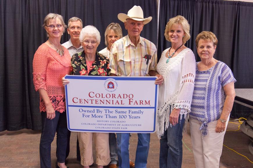 Shafer family (Union Ridge) with their Centennial Farm sign.