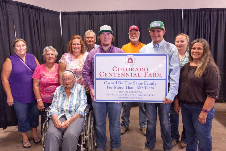Wacker Family with their Centennial Farms sign.