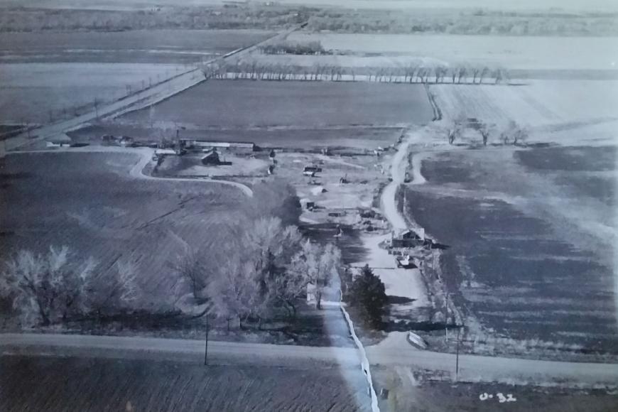 Black and white historic aerial view of Wacker Farms & Livestock.