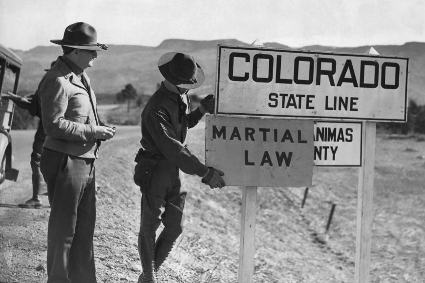 National Guard posting a sign at the Colorado border declaring martial law