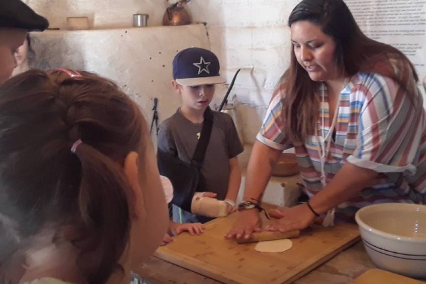 Students learn about tortilla making at El Pueblo History Museum.