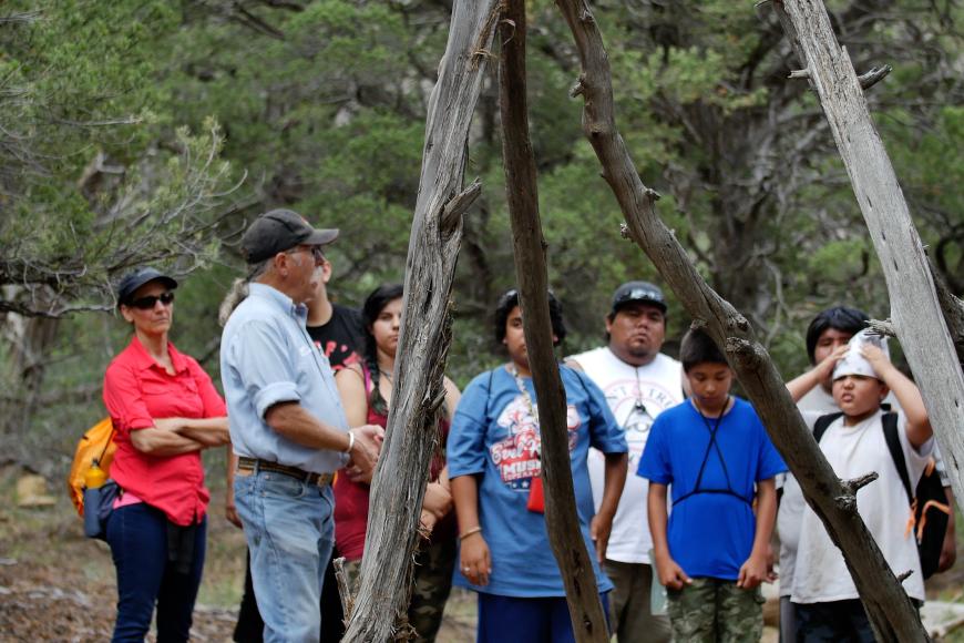 Ute youth, Ute elders, and archaeologists visit an historic Ute encampment in July, 2017.