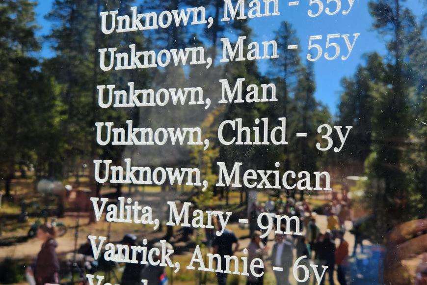 A close-up of the memorial of the Leadville Miners and their families, listing names: "Turner, Mary. Turney, Clarence. Eight unknown. Valita, Mary. Vanrick, Annie. Vaughn, Daniel. Veleta, Frank. Veo, Courine. Veo, Annie. Veo, Delia."