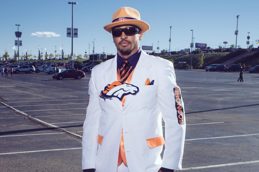Broncos superfan in a Broncos themed white suit