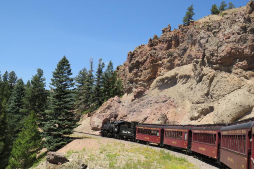 The Cumbres and Toltec Scenic Railroad moving down a mountain track.