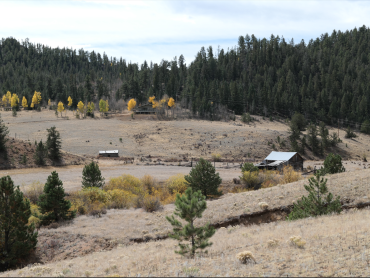 Overview of the Sprague Sand Creek Ranch showing its multiple eras of historic buildings. 