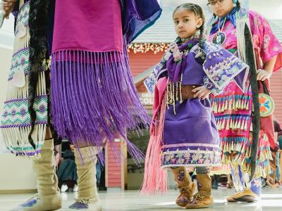 Young Ute Indian girl dancing 