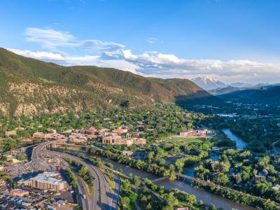 Aerial view of the Town of Glenwood Springs, Colorado in the Roaring Fork Valley and the Grand Avenue Bridge going over the Colorado River.