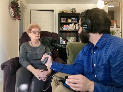 Clela Rorex being interviewed in her house.