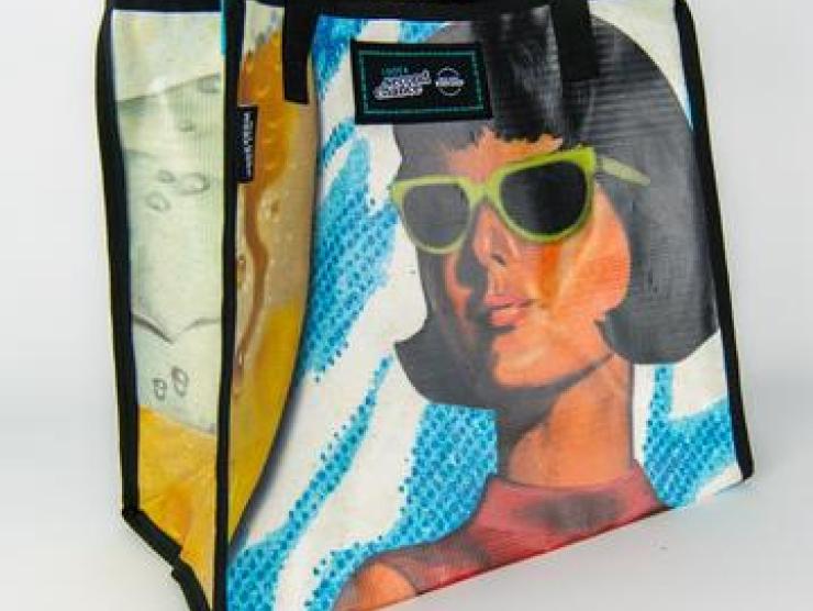 History Colorado Tote Bag, with the image of a woman wearing sunglasses on the exterior.