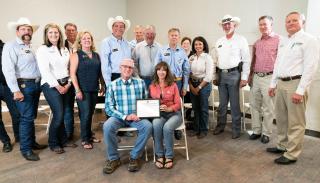 Family associated with the homestead hold their Centennial Farms certificate.