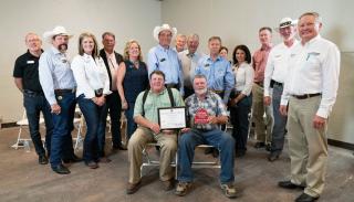 Members of the Hasart Family (seated) with their Centennial Farms certificate.
