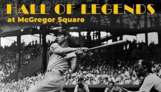 Black and white image of Joe DiMaggio hitting a baseball