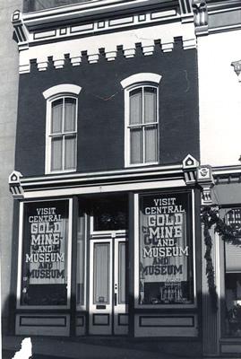 Black and white photo of a nineteenth century commercial structure.