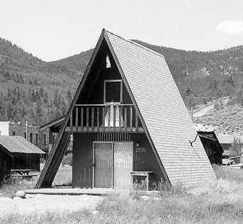 Black and white photo of an A-Frame house.
