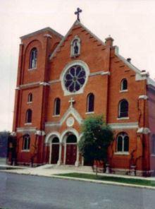 The red-brick Annunciation Church in Denver, which is built in the Gothic and Romanesque Revival styles.