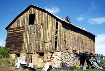 Color image of a bank barn.