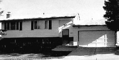 Black and white photo of a bi-level house in Castle Rock
