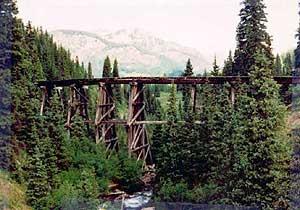 Color photo of a timber Stringer bridge.