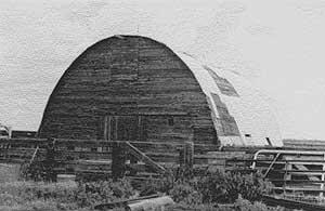 Black and white photo of a Round-Roof Barn.