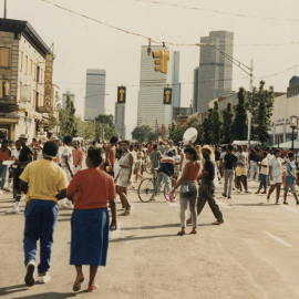 Historic color photo of people on a street with the Blaxplanation series logo superimposed