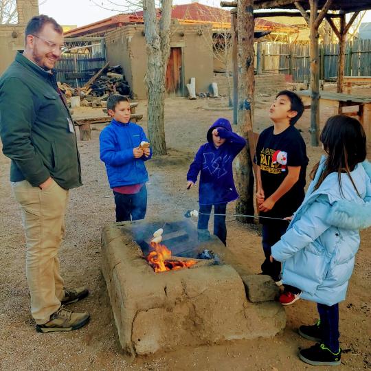 Hands-On History students at El Pueblo History Museum roasting marshmallows